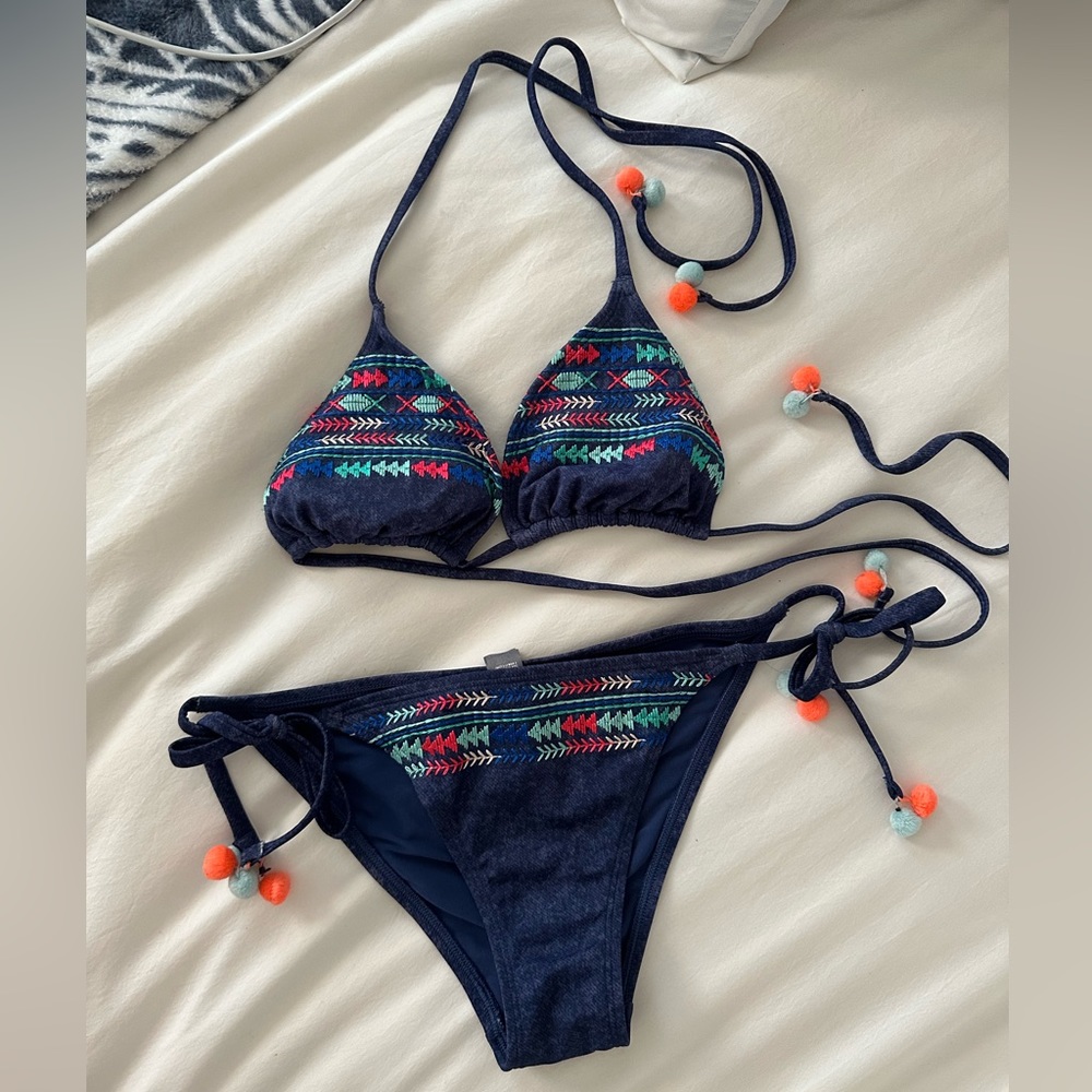 Matching swim set with cute pom poms